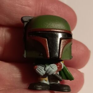 Green and Black Miniature Figure